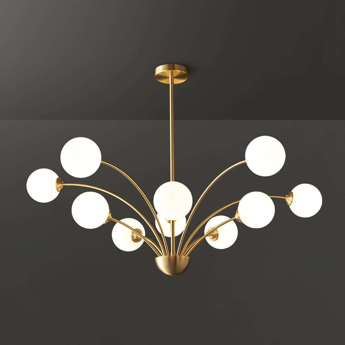 Ralem lámpara de araña con brazos curvos en latón