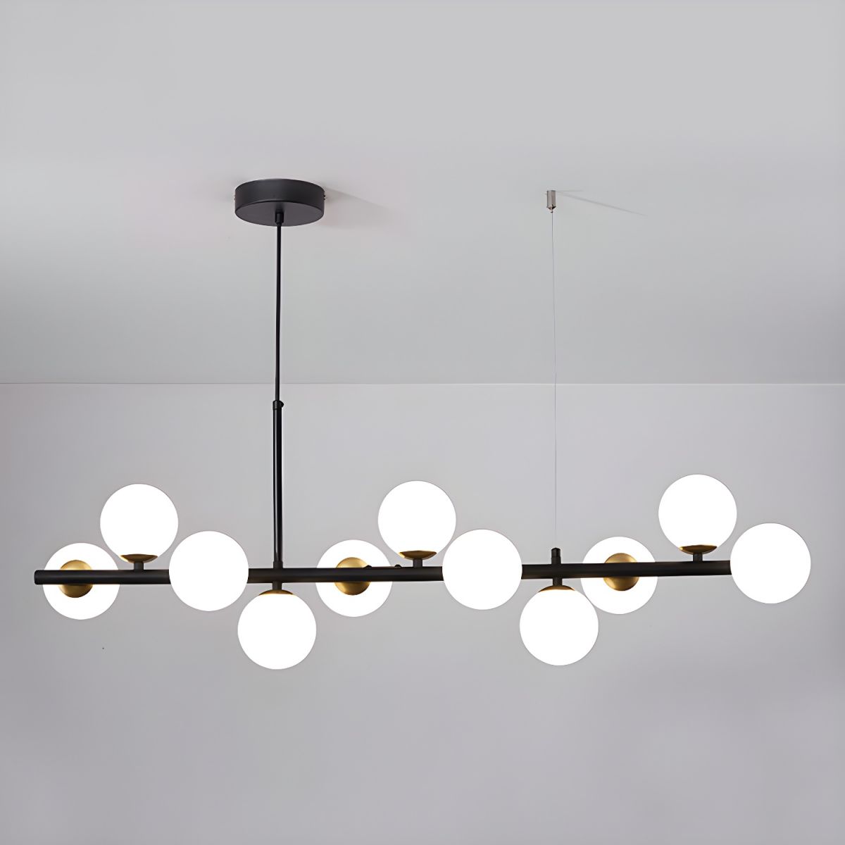 Lioroora lámpara de araña Globo de vidrio dorado 12-Light