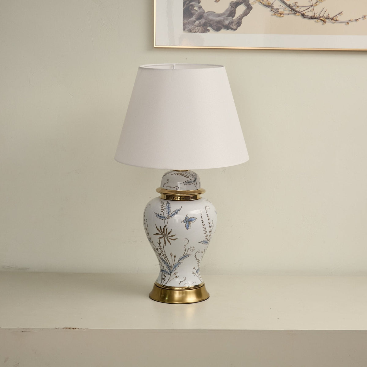Gilt lámpara de mesa con detalles en cerámica