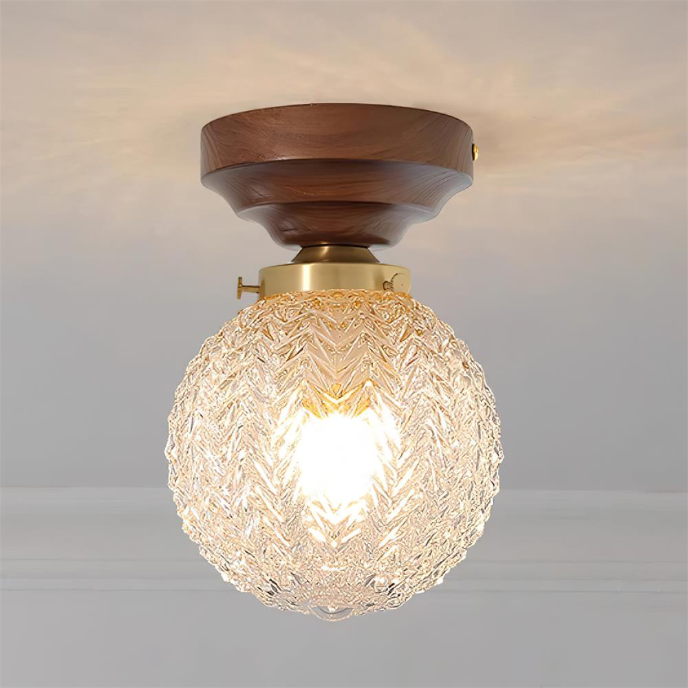 Lámpara de techo con cúpula de vidrio transparente y casquillo de latón, en madera de nogal esfera