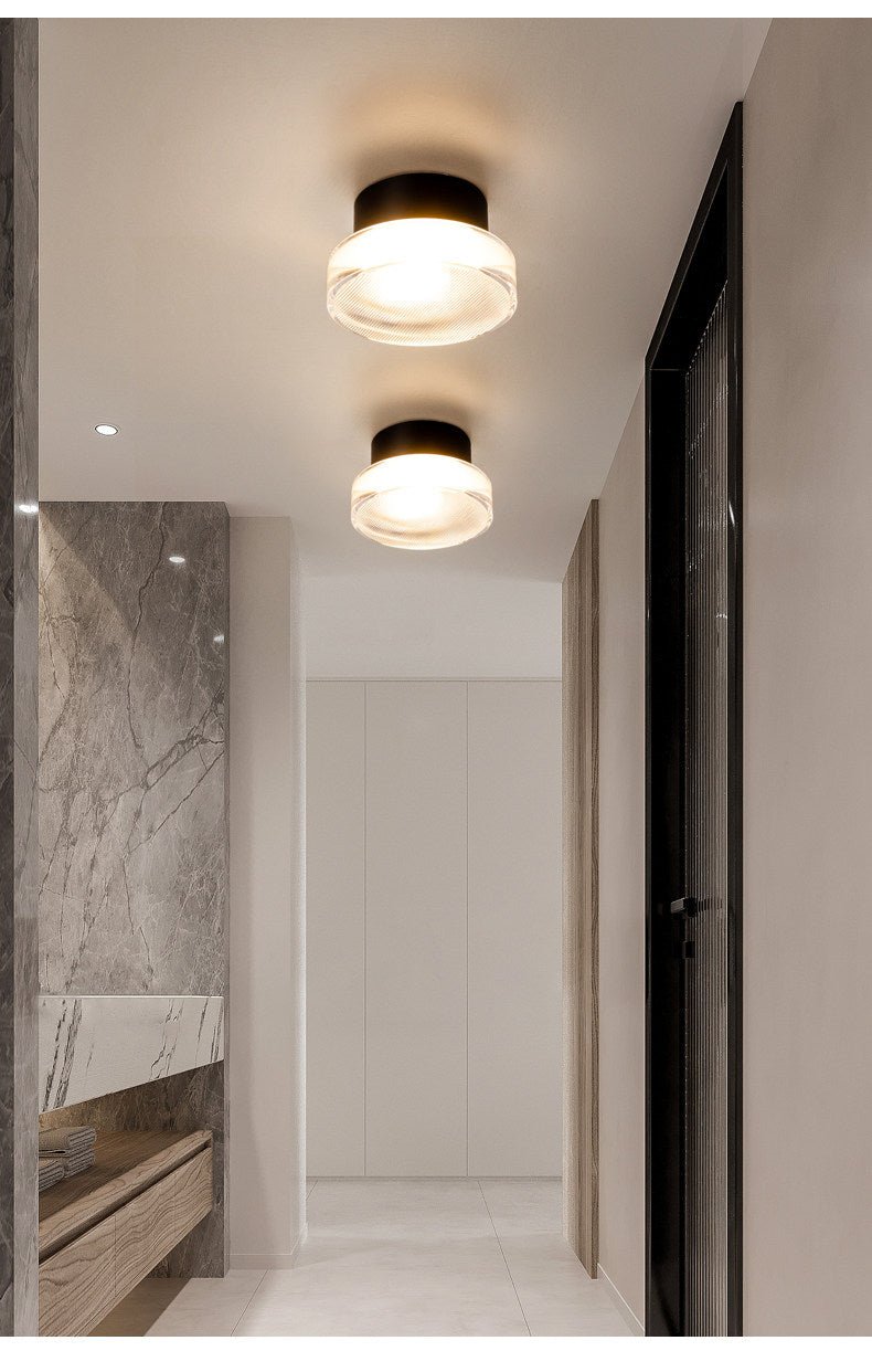 Noct aplique de pared con sombra de vidrio ribeteado