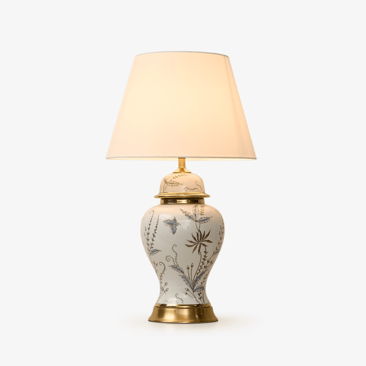 Gilt lámpara de mesa con detalles en cerámica